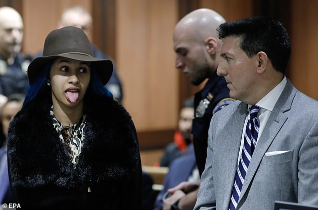 Newly single Cardi B sticks out her tongue as she finally appears in court over a fight at a strip club (Photos)